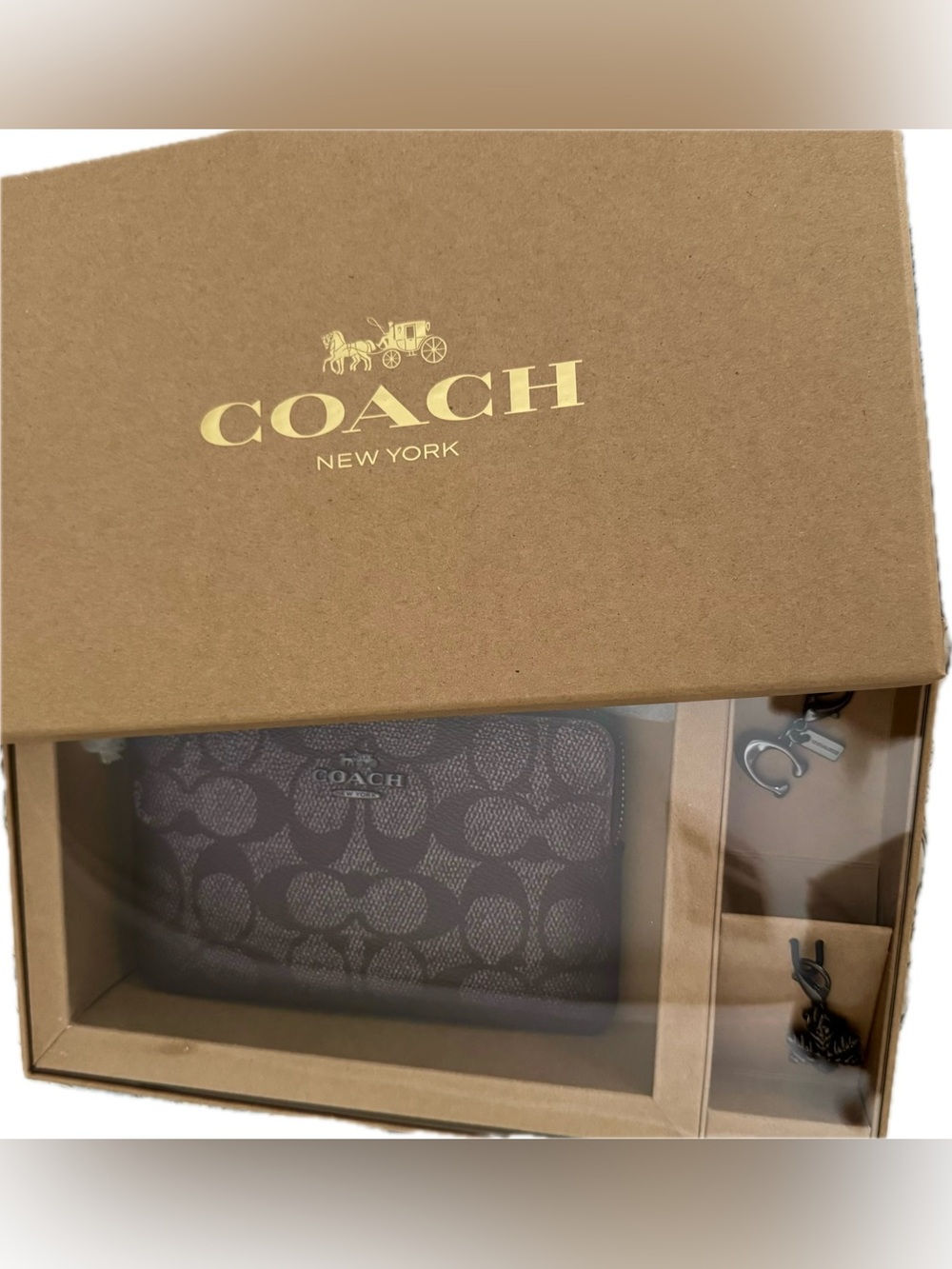 New Coach wristlet with “Signature C” and “snowflake” charms.